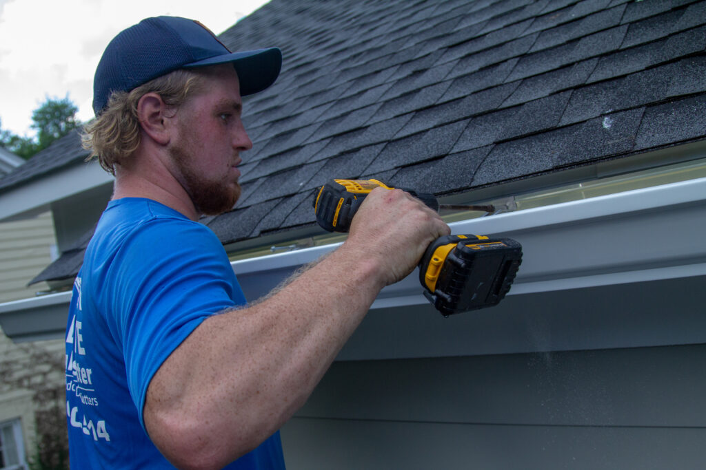 installing seamless gutter on house in Lexington SC by Columbia Gutter Pros